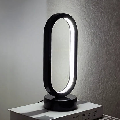 lampe à poser ovale mur gris